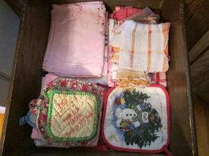 lot 134 image: Drawer of pot holders and towels...