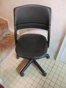 lot 183 image: Black office chair on wheels...