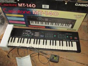 lot 214 image: Casio keyboard...