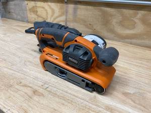 lot 78 image: RIGID 6.5 Amp Corded 3 in. x 18 in. Heavy-Duty Variable Speed Belt Sander with AIRGUARD Technology