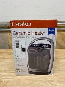 lot 107 image: LASKO Compact 11.25 in. 1500-Watt Electric Ceramic Portable Oscillating Space Heater