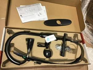 lot 27 image: Canton Single-Handle Pull-Down Sprayer Kitchen Faucet in Tuscan Bronze by Pfister  in good condition