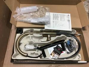 lot 43 image: Marca Single-Handle Pull-Down Marca Single-Handle Pull-Down Sprayer Kitchen Faucet with ShieldSpray Technology in Champagne Bronze by Delta  in good condition