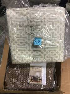 lot 89 image: Home Decorators Collection Camden Light Brown Wicker Outdoor Ottoman with Sunbrella Fretwork Mist Cushion  in good condition