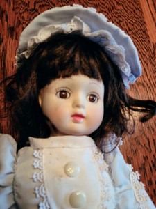 lot 54 image: Antique Bisque Music Box Doll