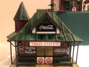lot 7 image: Eight- Piece Coca-Cola Stained Glass Village