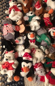 lot 25 image: Lots of Small Coca-Cola Plush Friends