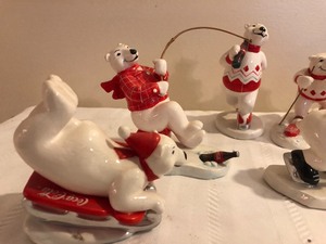 lot 47 image: Nine Coca-Cola Figurines Doing Winter Sports