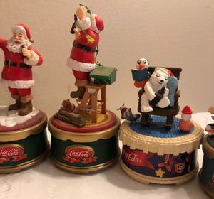 lot 84 image: 7 Coca-Cola Authorized Collection Musical figurines