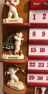 lot 82 image: Coca-Cola Figurine Calender on a Shelf