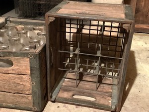 lot 104 image: Three Vintage Milk Crates and 11 Bottles