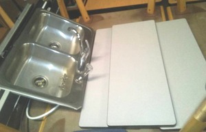 6 shelves from 3 to 7 foot long plus Kitchen sink