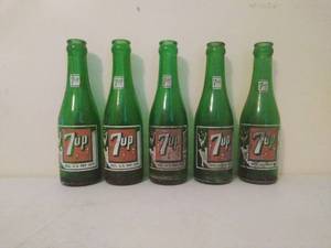 lot 69 image: Five Vintage 7up Bottles