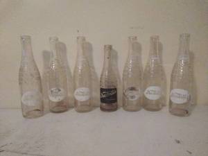 lot 70 image: Seven Vintage Nesbitts Bottles