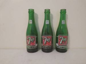 lot 71 image: Three Vintage 7up Bottles