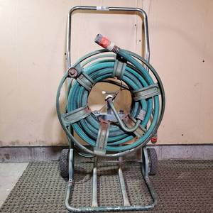 lot 001 image: Garden Hose and Reel Mobile Cart