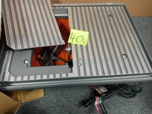 lot 40 image: 6.5 Amp Corded 7 in. Table Top Wet Tile Saw by RIDGID open box never used