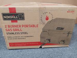 lot 77 image: 2-Burner Portable Propane Gas Table Top Grill in Stainless Steel by Nexgrill open box never used
