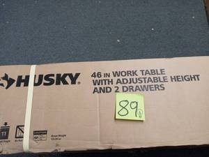 lot 89 image: 46 in. Adjustable Height Work Table with 2-Drawers in Black by Husky never used