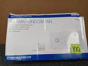 lot 100 image: 65-Watt 9 in. White Reversible Twin Window Fan open box never used