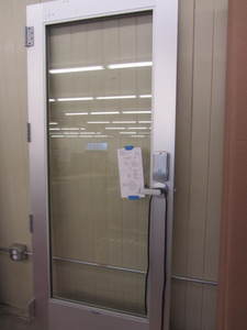lot 28 image: Aluminum commercial door with full ...