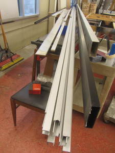 lot 63 image: Aluminum material 24ft 1x4, 20ft...