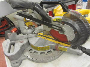 lot 104 image: DeWalt sliding compound miter saw, ...