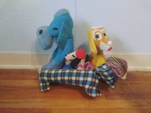 lot 74 image: Four Vintage Stuffed Dogs with Hats