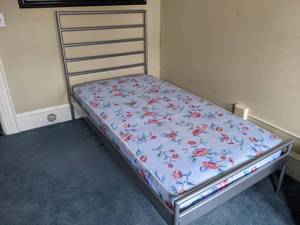 lot 33 image: Metal Framed Twin Bed from Ikea
