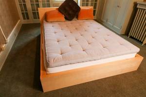 lot 52 image: Queen sized Ikea Malm Bed Frame with Mattress Topper