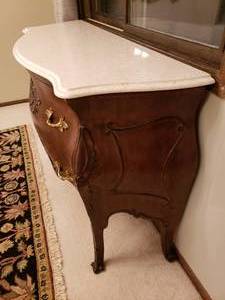 lot 4 image: Marble top hand carved mahogany buffet table