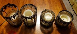 lot 62 image: 4 matching (2 tall, 2 short) Candle holders with a silver carriage holding glass lanterns