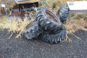 lot 760 image: Lot of (4) Solid Wall 10-16.5 Bobcat Tires with Steel Wheels