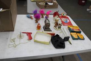 lot 500 image: Lot of (Approximately 20) Troll Dolls, Crayola Crayons, Pencil Sharpener, Table Dcor, Toy Gun, and more Assorted Collectibles