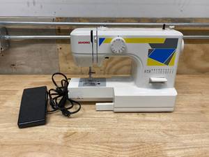 lot 7 image: JANOME MOD-11 Basic Sewing Machine with Top Drop-In Bobbin System