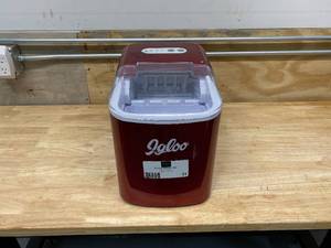 lot 31 image: IGLOO 26-Pound Portable Ice Maker, Retro Red