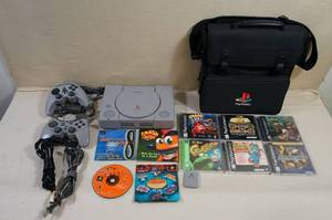 lot 151 image: Playstation 1 with Games - Crash, Dragons