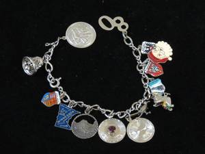 lot 42 image: Charm Bracelet - Some Sterling Charms