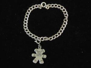 lot 55 image: Sterling Silver Charm Bracelet - Teddy Bear
