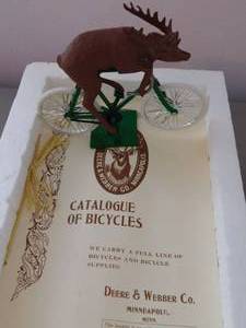 lot 85 image: John Deere on Bicycle