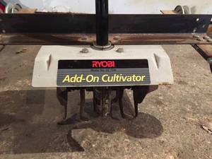 lot 9 image: Ryobi Add-On Cultivator