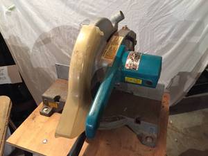 lot 32 image: Makita Miter Saw On Rolling Cart