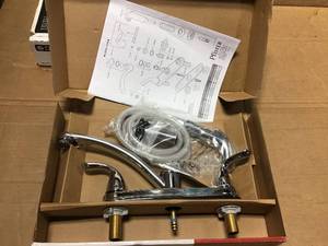 Delton 2-Handle Standard Kitchen Faucet with Side Sprayer in Polished Chrome  by Pfisterin good condition
