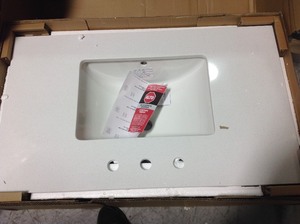 37 in. W x 22 in. D Engineered Marble Vanity Top in Snowstorm with White Single Trough Sink by Home Decorators Collection IN GOOD CONDITIONS