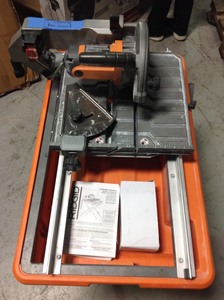 9 Amp Corded 7 in. Wet Tile Saw with Stand by RIDGID in good conditions