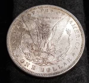 1885 MORGAN SILVER DOLLAR UNC with odd reverse toning