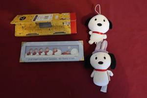 lot 64 image: Peanuts Lot - 2 Snoopy Plush Toys and Framed Comic Strip