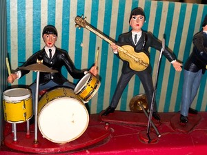 lot 113 image: 1960s Beatles Cake Topper and Three Disc Set
