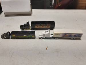 lot 18 image: 3-John Deere, 1-MIller Semi