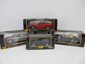 lot 39 image: 4 New In Box MAISTO Diecast Metal Cars
